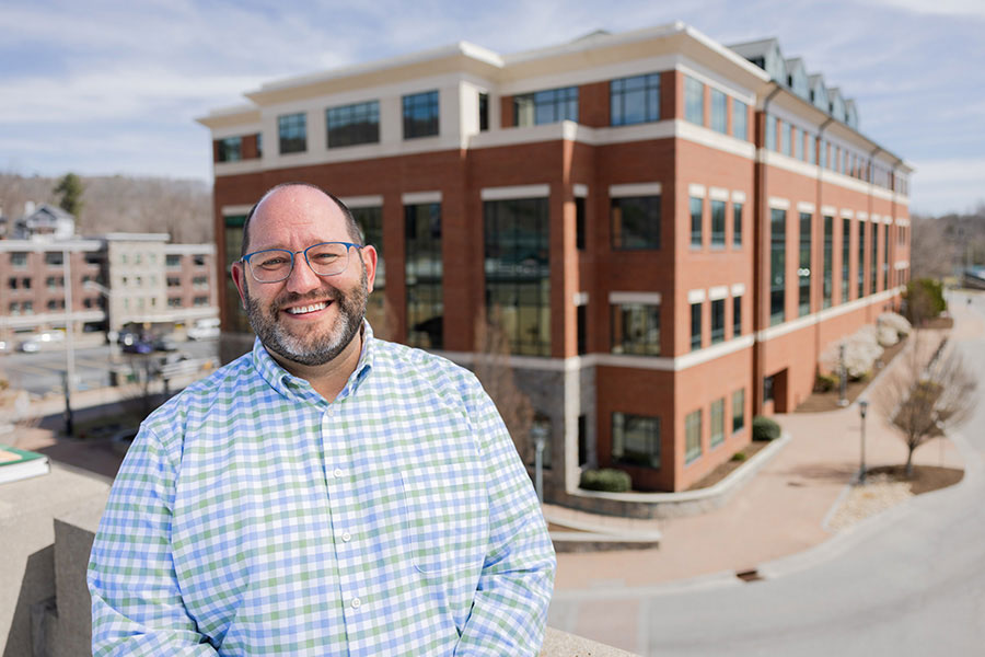Dr. Andrew Koricich, professor in the higher education graduate program in App State’s Reich College of Education, visible in the background.