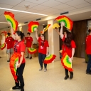 High school students learning Chinese dance movements during a cultural workshop. 