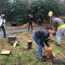 Talk about hands-on learning! AMS students teaching ASU visitors how to chop wood on a dreary Saturday.