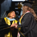 Dean Spooner congratulates graduate