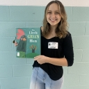 Brook Boyd holds book for App Ed Reads.