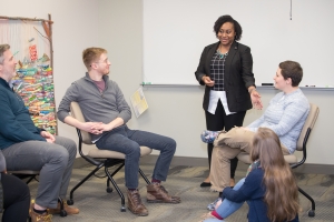 Dominique Hammonds talking with students