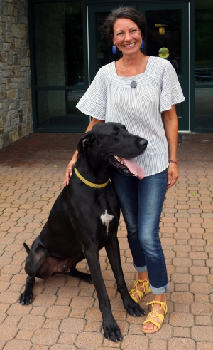 Karla with her dog, Sydney. Sydney is a registered therapy dog.