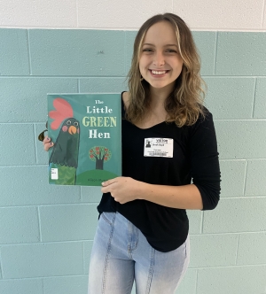 Brook Boyd holds book for App Ed Reads.