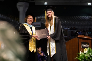 Dean Spooner with graduate