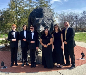 Patton Band Director Chad Higdon is pictured with some of his students from The Patton High School Panther Regiment on the campus of Lenoir-Rhyne University in Hickory.