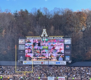 Mountaineer Readers on the Jumbotron waving