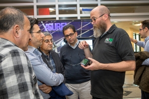 Data and Assessment Specialist Jim Dees in Appalachian State University’s Office of Sustainability, right, shows visitors from Kurdistan, Iraq, a mobile app during a campus tour of Appalachian’s sustainability initiatives.