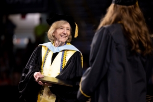 Dean Spooner congratulates graduate