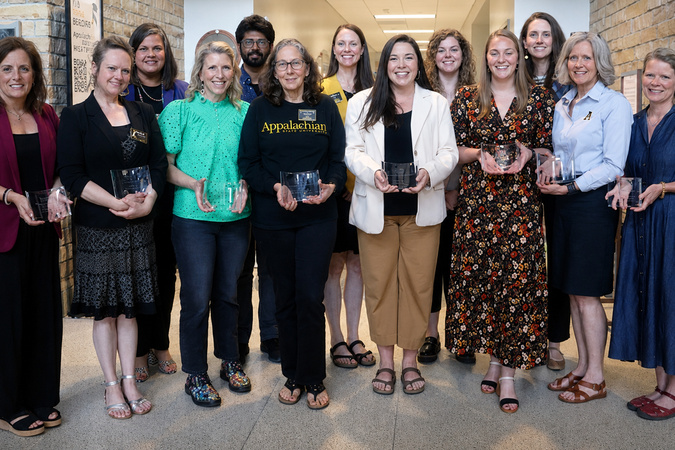 2025 RCOE Award Winners holding awards.