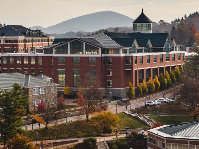 College of Education surrounded by mountains and the App State library