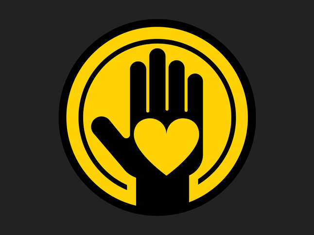 Yellow icon of heart in a hand in a circle on a dark background.