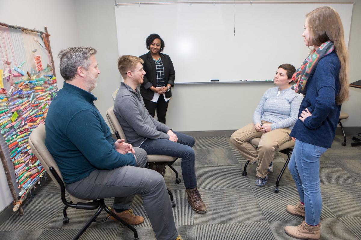 Dominique Hammonds with students