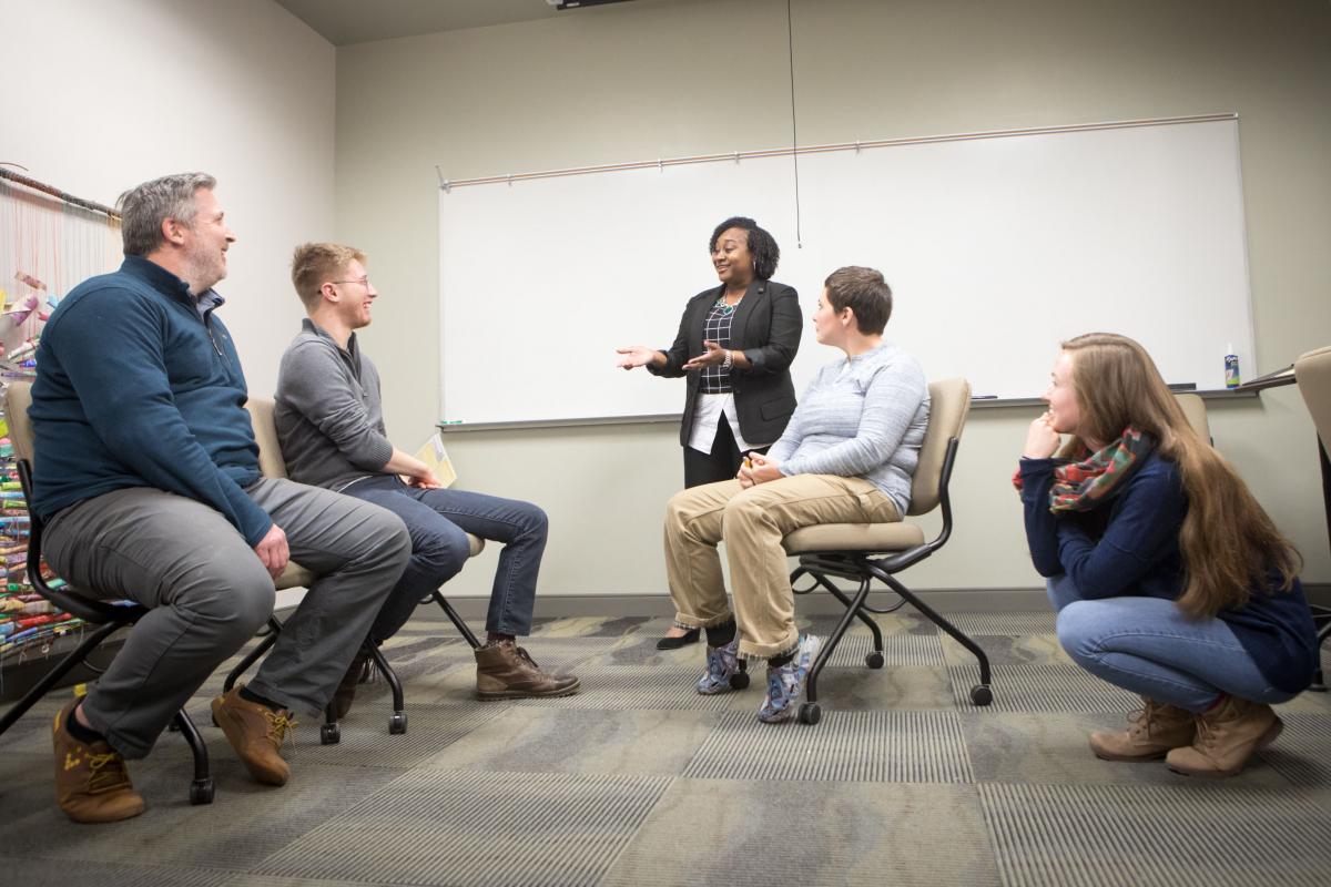 Dominique Hammonds with students