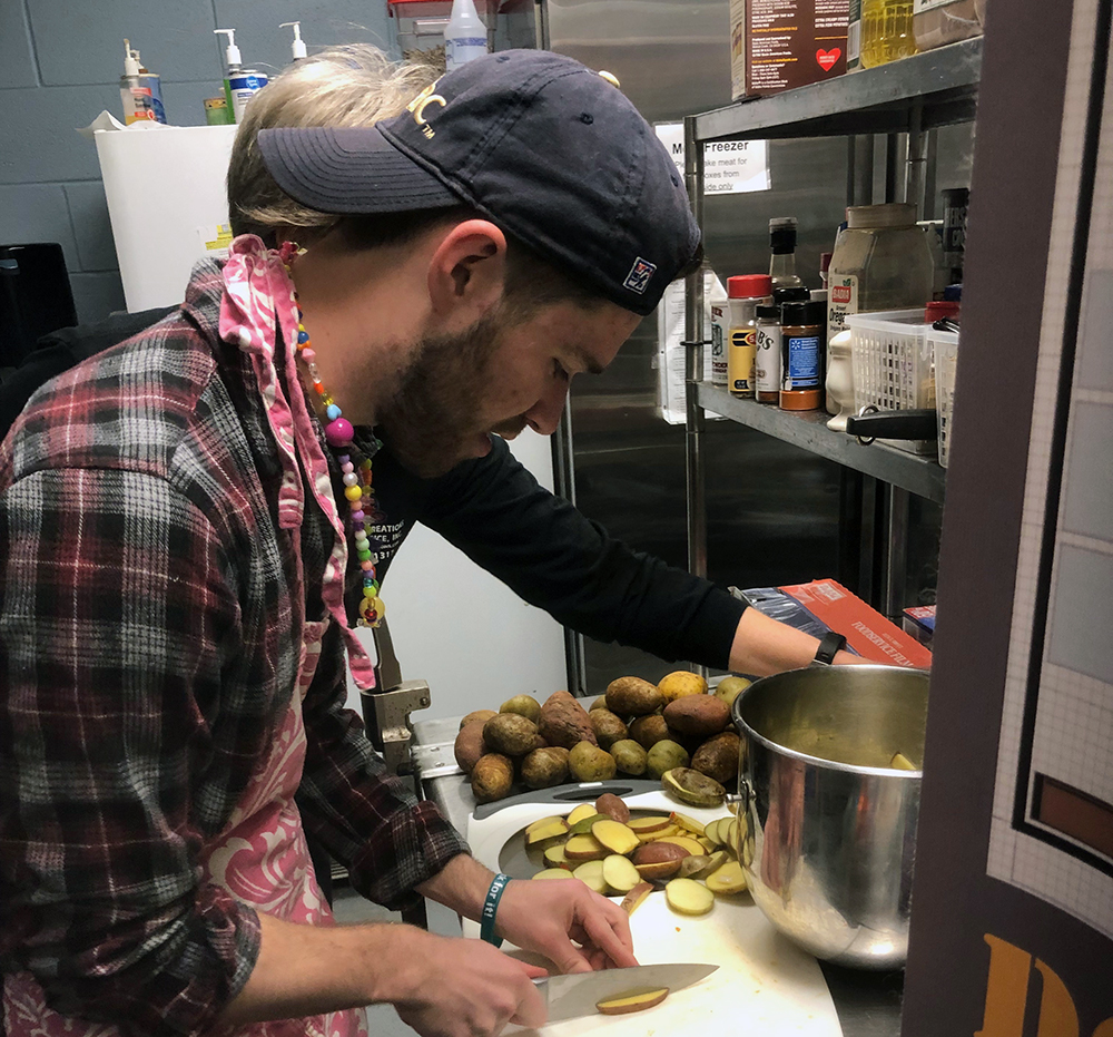 Alex Olinger hand cuts russet potatoes and sweet potatoes to home-baked french fries. Photo submitted