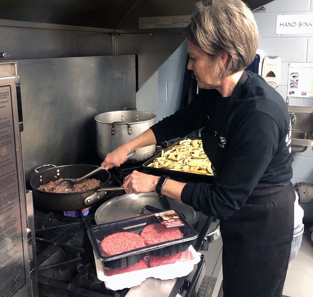 Isaacs helps prepare the main course for the evening, sloppy joes. Photo submitted