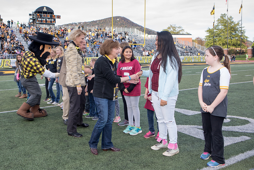 Mountaineer Readers greeted on the field by RCOE Dean Spooner, Chancellor Everts, AD Gillin and Yosef