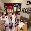 ROBERT C. REED/HICKORY DAILY RECORD: Ashley Bandy, 2011 valedictorian at Newton Conover High School, is now a mathematics teacher at her hometown high school as she holds her teacher identification card.