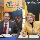 Caldwell Community College and Technical Institute President Dr. Mark Poarch, left, and Appalachian State University Chancellor Dr. Sheri Everts sign the Aspire Appalachian Co-Admission Program agreement on Wednesday, Dec. 12, in the B.B. Dougherty Administration Building on Appalachian’s campus in Boone. Photo by Marie Freeman