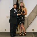 Les Miller, student employment coordinator in the Career Development Center at Appalachian, left, presents Appalachian junior Sara Jayne Vess with a plaque as part of her Student Employee of the Year Award. Vess, of Indian Land, South Carolina, is a junior elementary education major at Appalachian and works as a student employee in the Career Development Center. In addition to the pictured plaque, her award also came with a $1,000 scholarship. Photo by Jeremiah Bradshaw