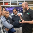 Data and Assessment Specialist Jim Dees in Appalachian State University’s Office of Sustainability, right, shows visitors from Kurdistan, Iraq, a mobile app during a campus tour of Appalachian’s sustainability initiatives.