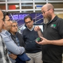 Data and Assessment Specialist Jim Dees in Appalachian State University, right, shows visitors from Kurdistan, Iraq, a mobile app during a campus tour of Appalachian’s sustainability initiatives. Photo credit: Marie Freeman.
