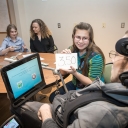Pictured from left to right, SDAP student Reid Pond, from Boone, Mary Strong ’16 ’17, transition and career coordinator for SDAP, and SDAP students Elizabeth Droessler, from Wake Forest, and Luke Wilcox, from Boone, practice counting money as part of the training at ECRS. Photo by Marie Freeman