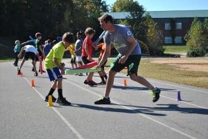 Boys participate in a challenge during the Xcel2Fitness after-school program designed by Stephen Vaughn ’05, who